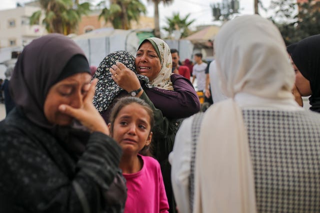 Palestinian women mourn their dead