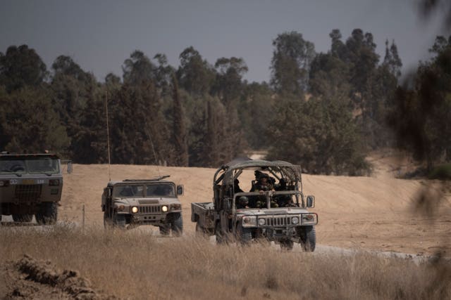 Israeli soldiers in trucks