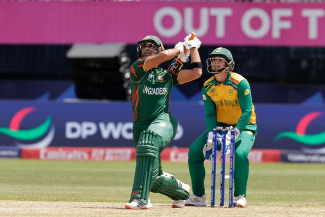 Bangladesh’s Mahmudullah Riyad plays a shot before he is caught at the boundary by South Africa’s captain Aiden Markram during the ICC Men’s T20 World Cup cricket match between Bangladesh and South Africa at the Nassau County International Cricket Stadium in Westbury, New York