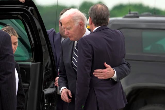 President Joe Biden greets his son Hunter Biden at Delaware Air National Guard Base in New Castle