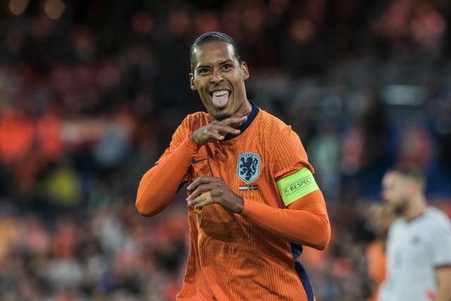 Netherlands’ Virgil van Dijk celebrates scoring a goal against Iceland