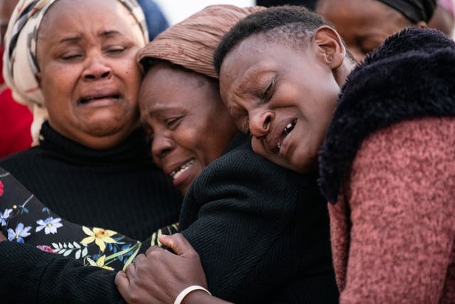 Mourners shed tears at the airport