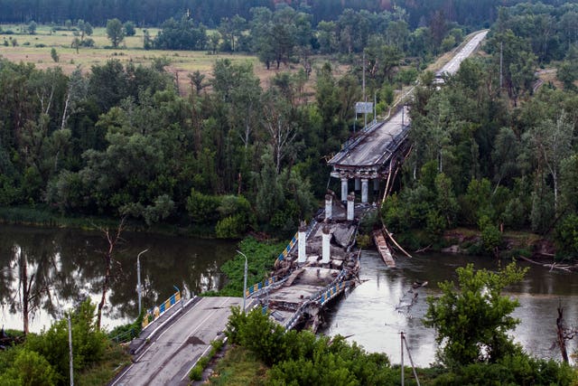 A destroyed bridge across Siverskyi-Donets river in Ukraine