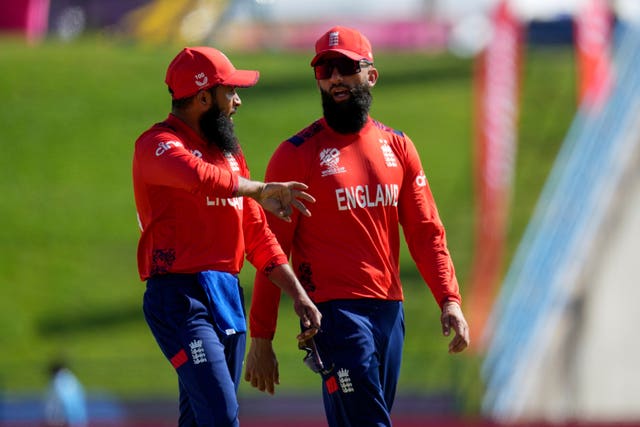 Adil Rashid, left, chats to Moeen Ali during a T20 World Cup game 