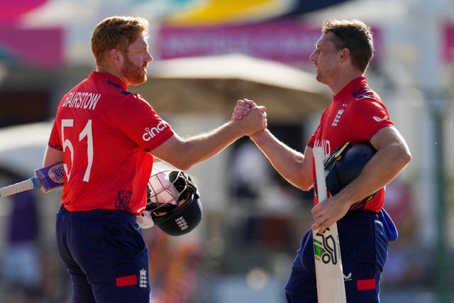 Jos Buttler, right, and Jonny Bairstow saw England over the line in record time (Ricardo Malazan/AP)