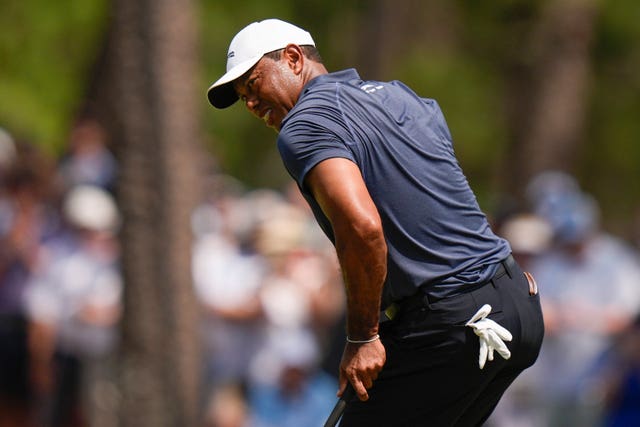 Tiger Woods reacts after missing a putt on the seventh hole