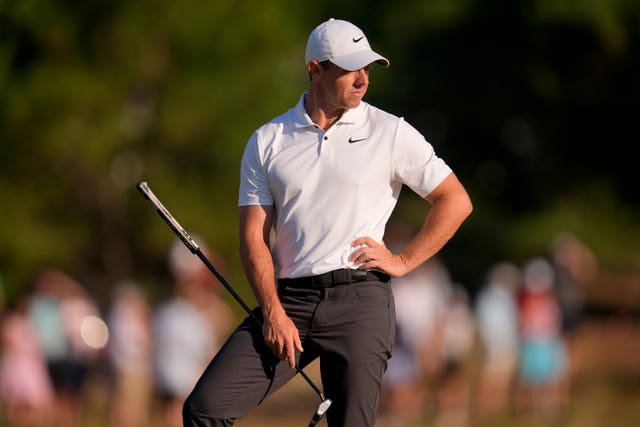 Rory McIlroy, with hand on hip, waits to play a shot in the US Open