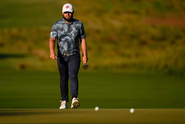 Tyrrell Hatton walks to the first green in round two of the US Open