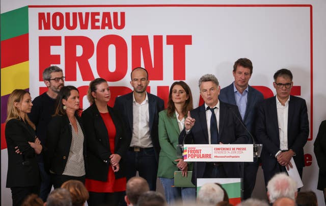 Communist Party national secretary Fabien Roussel, gestures as he speaks during a media conference as he is surrounded by leaders of France's left-wing coalition for the upcoming election attend a media conference in Paris