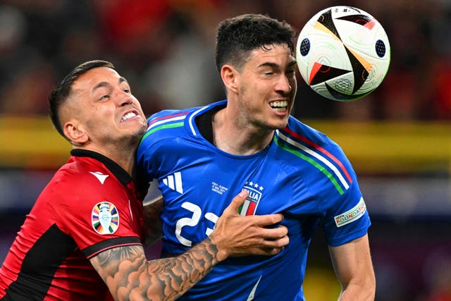 Defending champions Italy edged out Albania in their opening group match