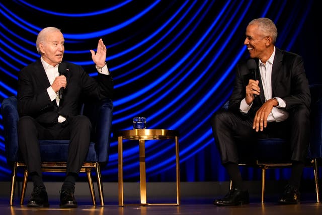 Joe Biden and Barack Obama share a joke on stage