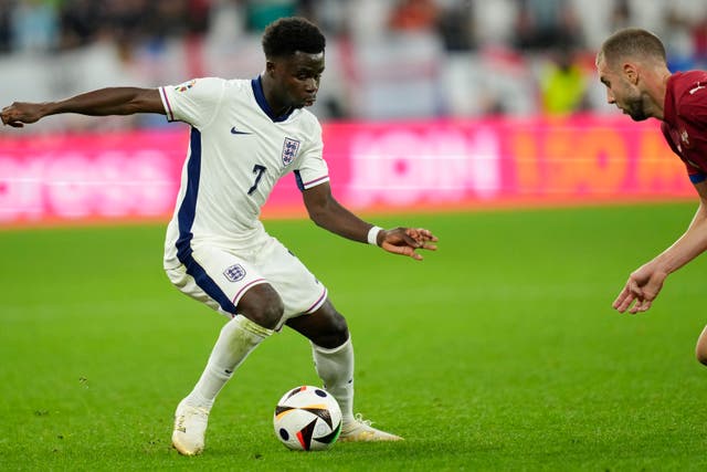 England’s Bukayo Saka, left, challenges for the ball with Serbia’s Strahinja Pavlovic during their Euro 2024 fixture