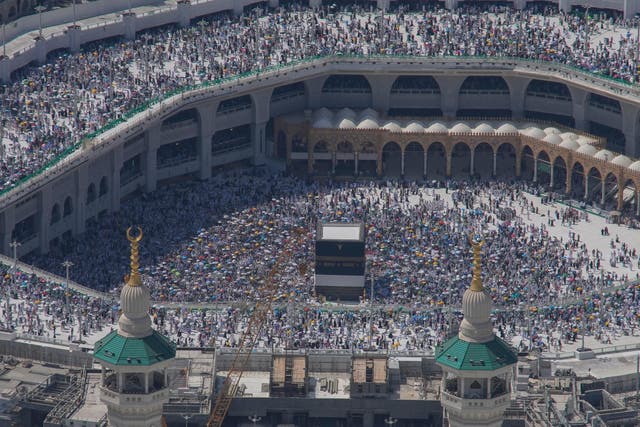 Thousands of pilgrims circle the Kaaba cubic building