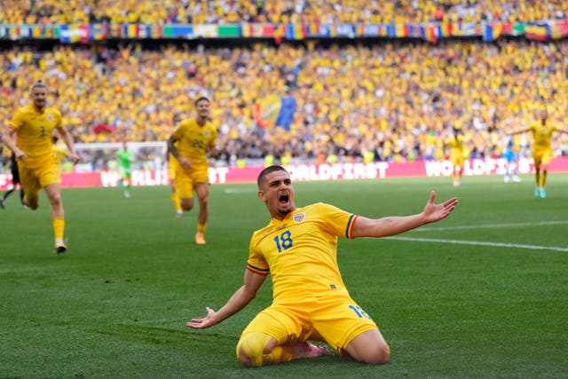 Romania’s Razvan Marin celebrates scoring his side’s second goal in a 3-0 win over Ukraine
