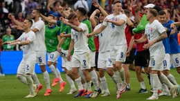 Slovakia players celebrate after a 1-0 victory over Belgium (AP Photo/Michael Probst/PA)