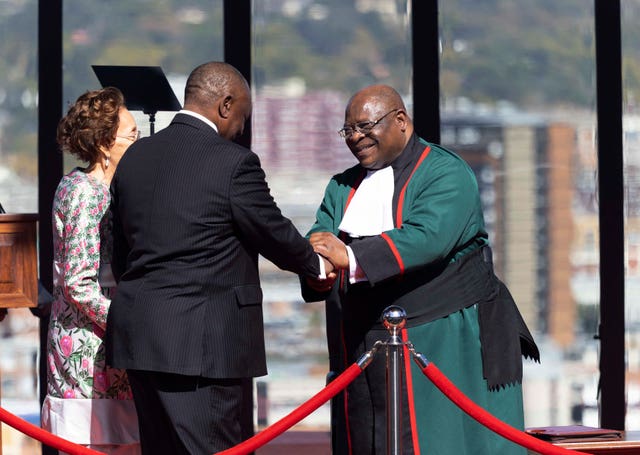 Cyril Ramaphosa is greeted by Chief Justice Raymond Zondo