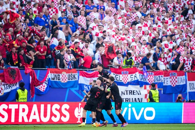 Albania's players celebrate after Klaus Gjasula scores a late equaliser in his side's 2-2 draw with Croatia in Hamburg