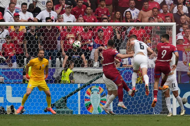 Serbia’s Luka Jovic, centre, heads home in stoppage time