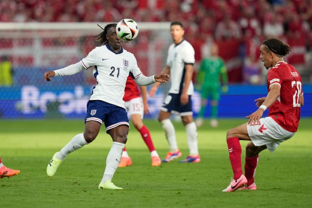 England winger Eberechi Eze tries control the ball past Denmark’s Yussuf Poulsen