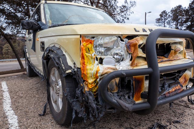 A view of the front of a vehicle that has been melted by the heat of the fire