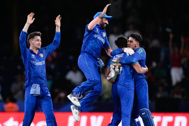 Afghanistan players celebrate after defeating Australia at the T20 World Cup 