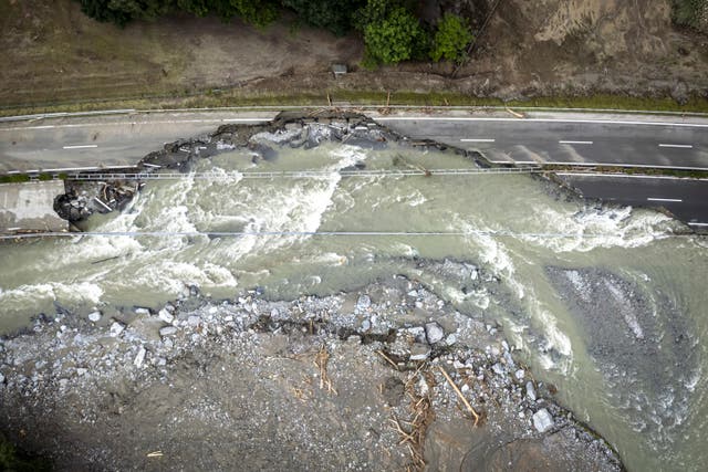 Aerial view of landslide, with water now flowing through what was a main road