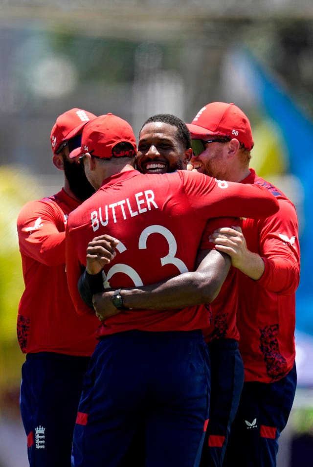 Chris Jordan, second right, celebrates with his England team-mates after his hat-trick 