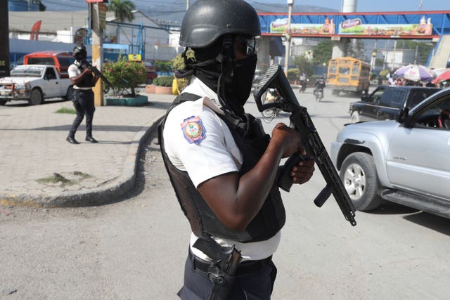 National police patrol an intersection in Port-au-Prince