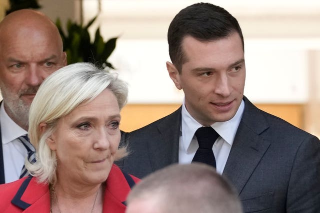 Far-right National Rally president Jordan Bardella, right, with party leader Marine Le Pen 