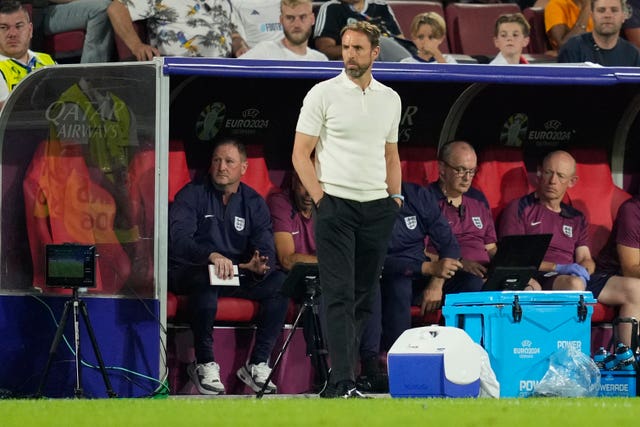 Gareth Southgate stands by the dugout during England's group game against Slovenia