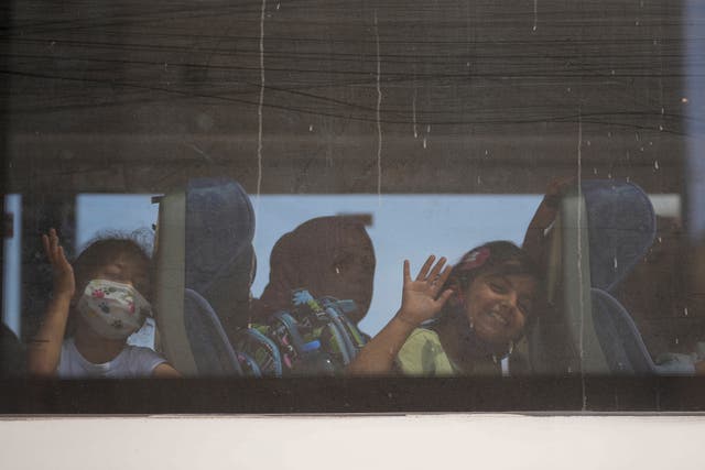 Palestinian children seen through window of bus