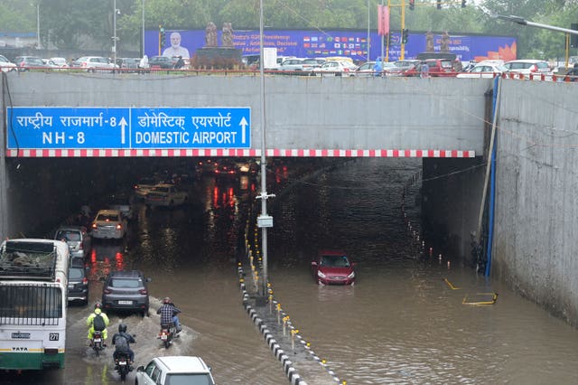 A flooded road near the Indira Gandhi International Airport in New Delhi 