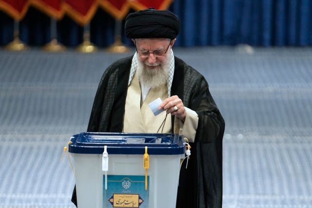 Iranian Supreme Leader Ayatollah Ali Khamenei drops his vote in a ballot box during the presidential election 