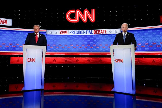 US president Joe Biden, right, and Republican presidential candidate former President Donald Trump stand during break in a presidential debate 