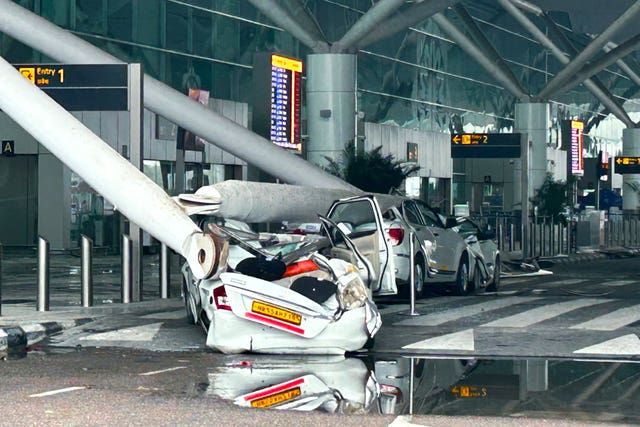 Parked vehicles damaged by the collapse 