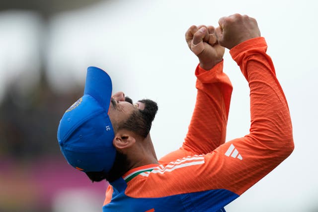 Virat Kohli celebrates after India's win is confirmed