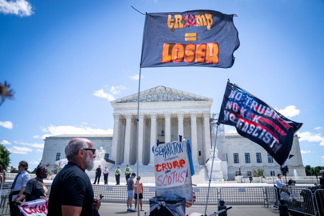 People protest outside of the US Supreme Court in Washington