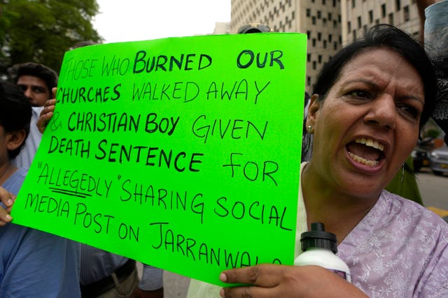 A member of Pakistan’s minority community chants slogans during a demonstration against the conviction of a Christian man on charges of blasphemy