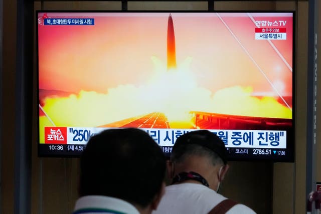 A TV screen shows a file image of North Korea’s missile launch during a news programme at Seoul Railway Station in Seoul, South Korea