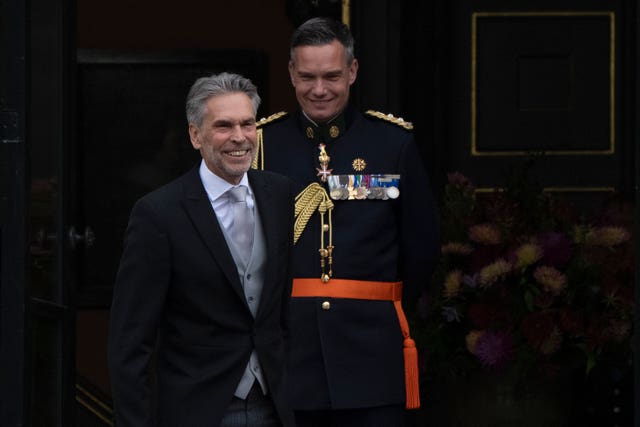 Incoming Prime Minister Dick Schoof, left, arrives at the royal palace to be sworn in by Dutch King Willem-Alexander in The Hague, Netherlands
