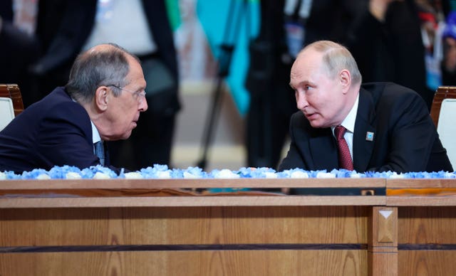 Russian President Vladimir Putin, right, and Russian Foreign Minister Sergei Lavrov 