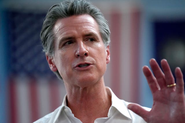 Gavin Newsom gestures as he speaks