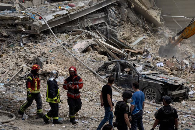 Rescue teams working among the rubble