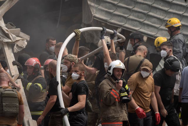 Rescue teams search through the rubble