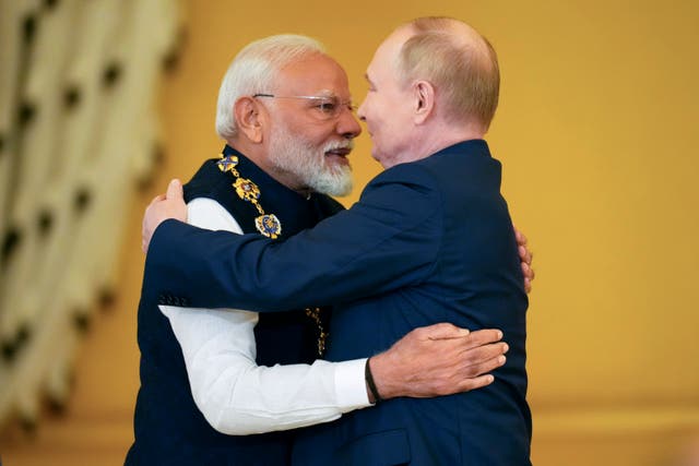 Narendra Modi embracing Vladimir Putin