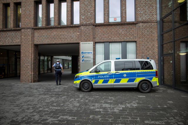 A police vehicle is parked in front of the Rheinmetall AG headquarters in Duesseldorf
