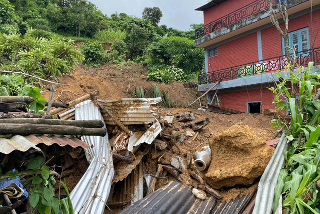 Damaged houses knocked by landslides are seen on the outskirts of Pokhara, Nepa