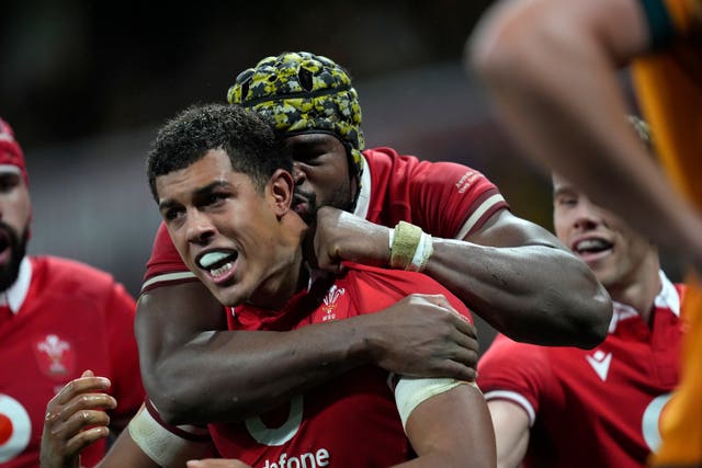 Wales’ Rio Dyer, left, celebrates with team-mate Christ Tshiunza after scoring a try