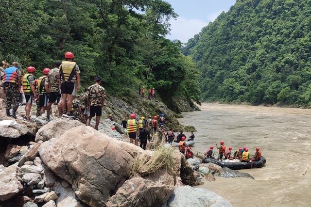 Nepal army personnel carry out a search operation looking for the survivors