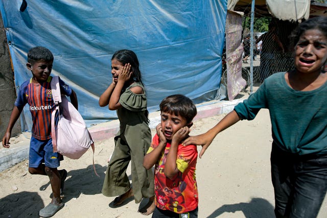 Palestinian children are evacuated from a site in Khan Younis in the southern Gaza Strip